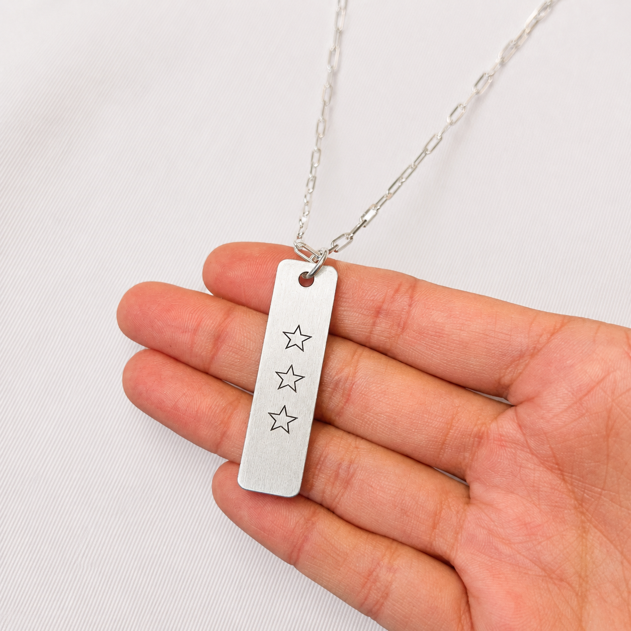 Collar placa estrellas